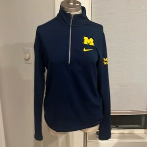 Dri-Fit quarter zip, navy blue and maize letters on navy background.